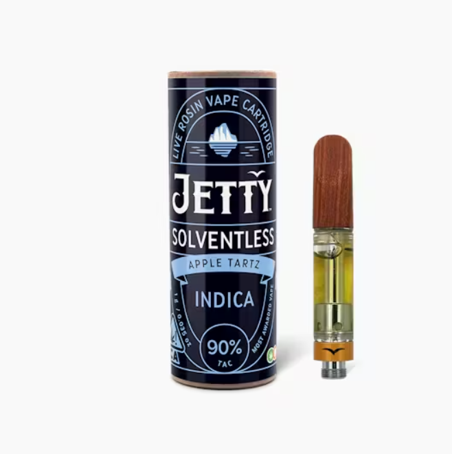 Jetty Extracts Apple Tartz vape cartridge beside its Jetty Extracts retail packaging