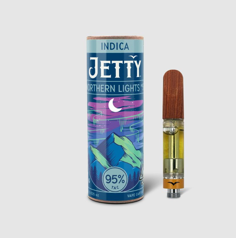 Jetty Extracts Northern Lights #5 vape cartridge beside its Jetty Extracts retail packaging
